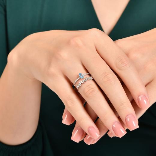 0.82 kt. Diamant-Cherry-Baguette-Blautopas-Ring